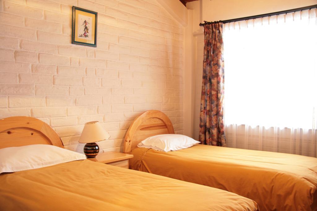 Apartamentos Los Quipus キト 部屋 写真